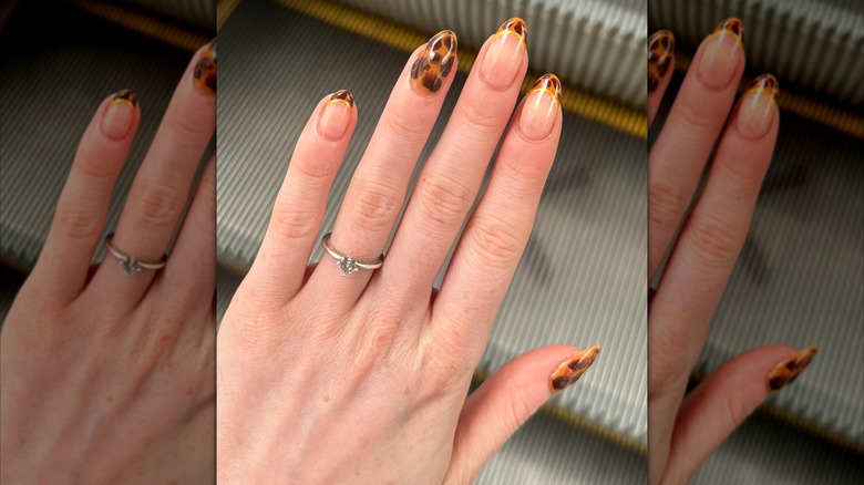A manicure with animal-print details.