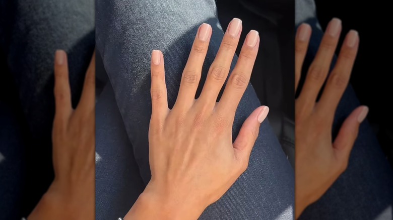 Woman with pale pink nails