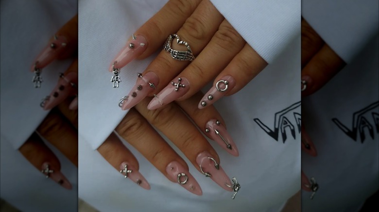 Woman with pierced nails