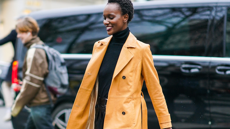 Tan leather trenchcoat with black turtle neck