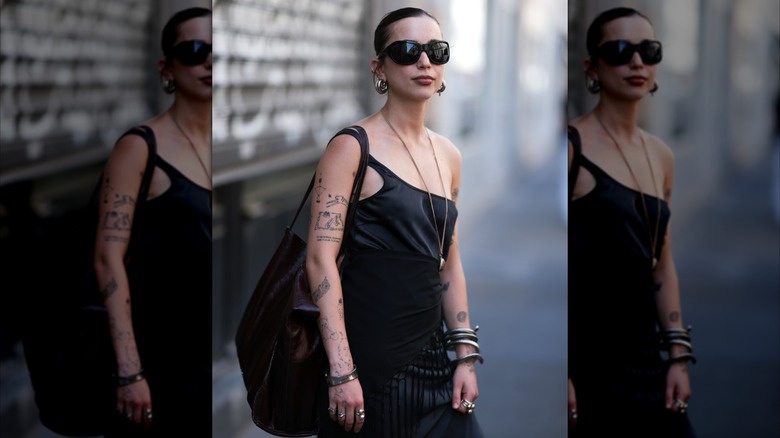 Guest wearing mixed metal jewelry at Paris Fashion Week 2026