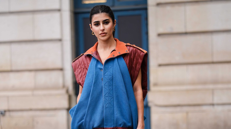 Girl wearing blue and orange outfit