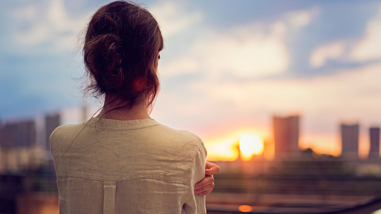 woman looking at city horizon