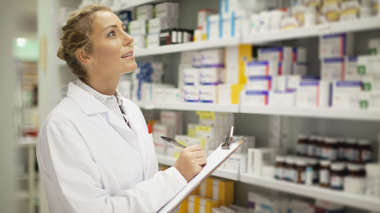 Pharmacist checking on stock