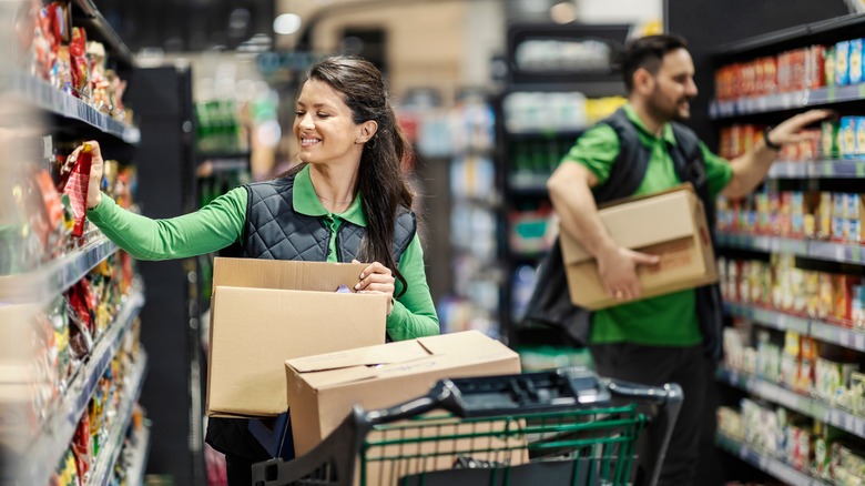 Store co-workers working, smiling