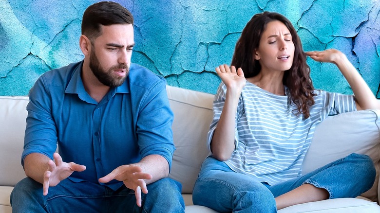 couple arguing on a couch