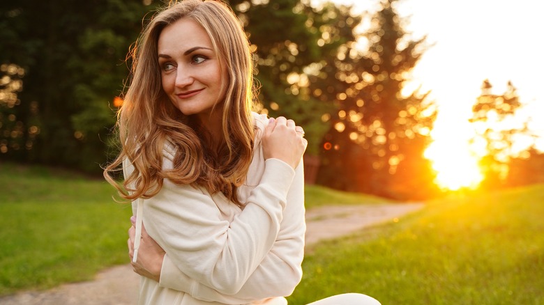 woman giving herself a hug