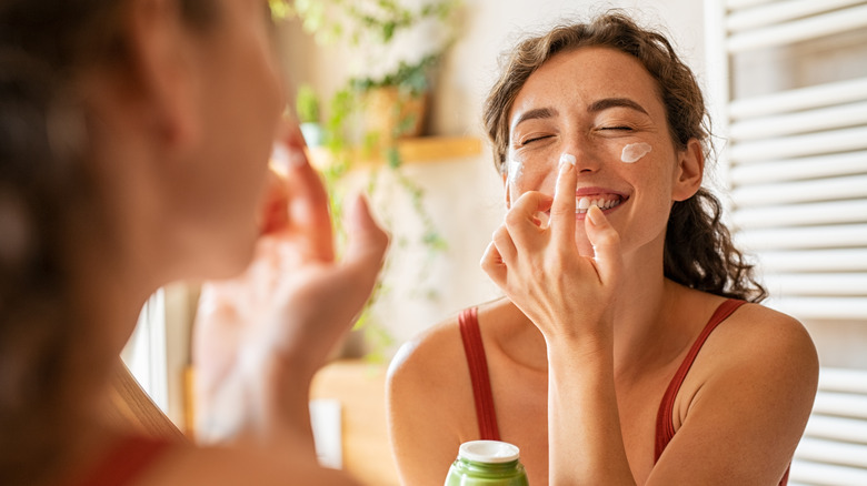 Woman caring for skin on her nose
