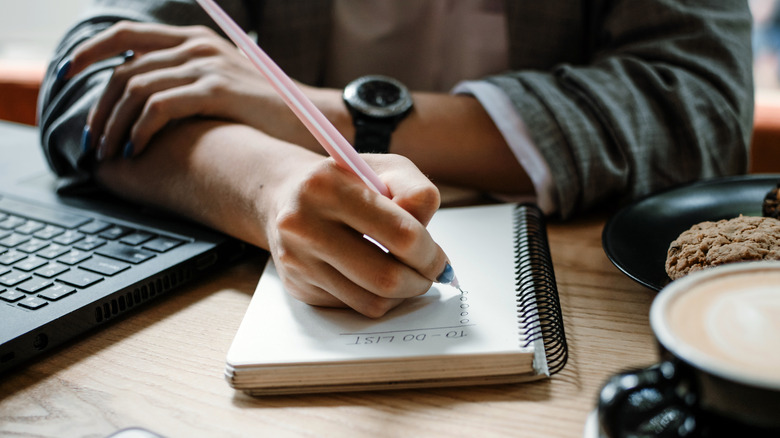Person writing to-do list
