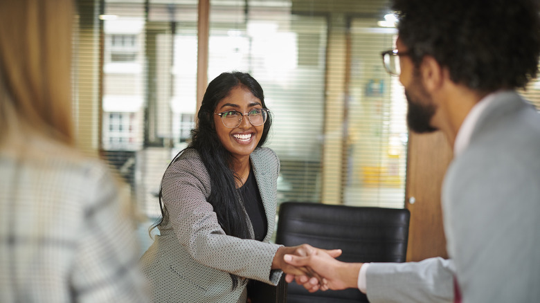 people shaking hands at job interview