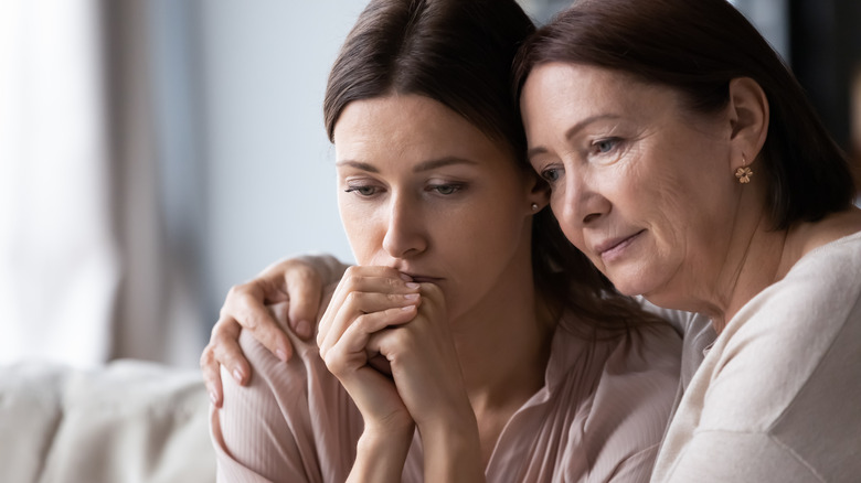 woman and mother hugging