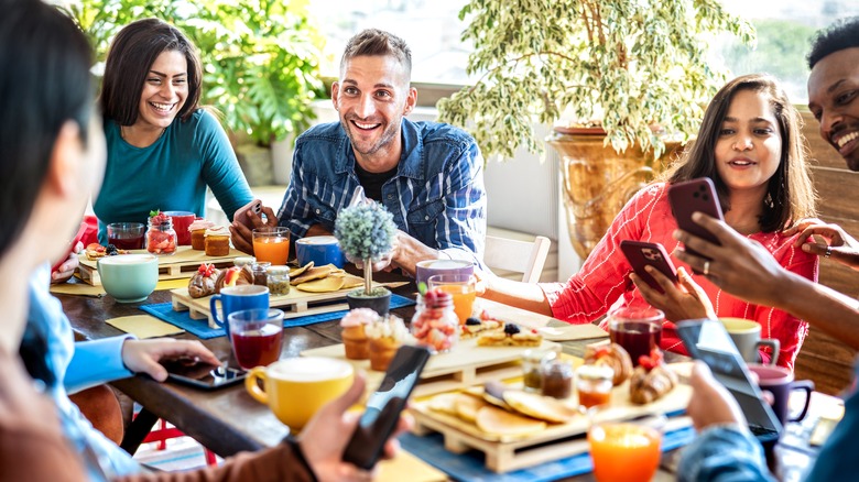 friends talking and laughing eating brunch