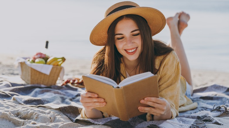 Woman reading at the beach
