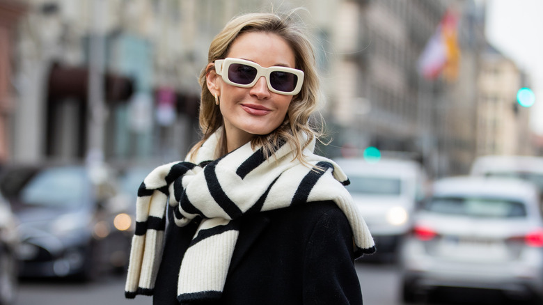 Woman with sweater over shoulders 