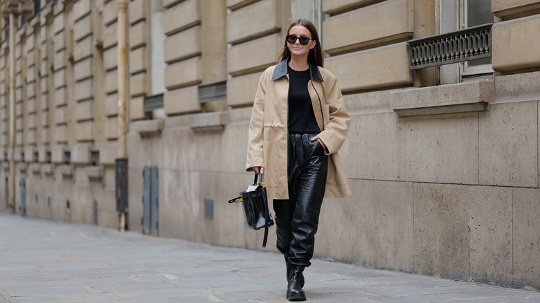 woman wearing black t shirt with trench coat