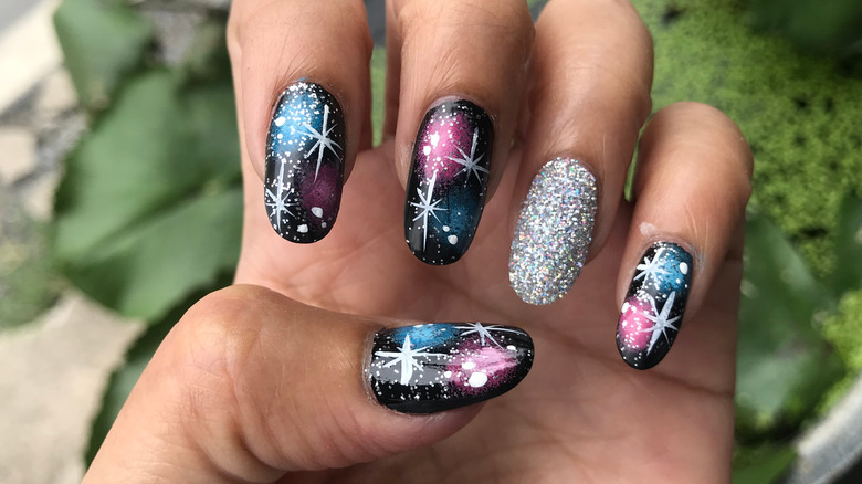 closeup on galaxy nails motifs