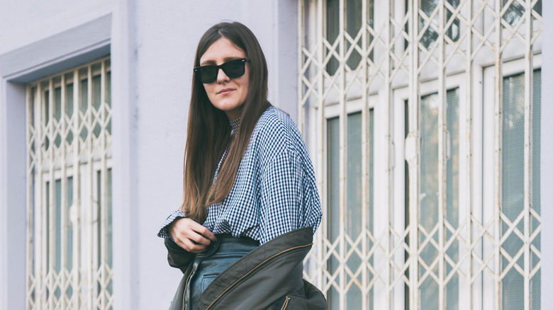 person in a gingham shirt