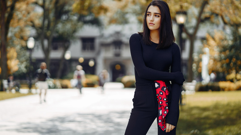 woman in black with scarf