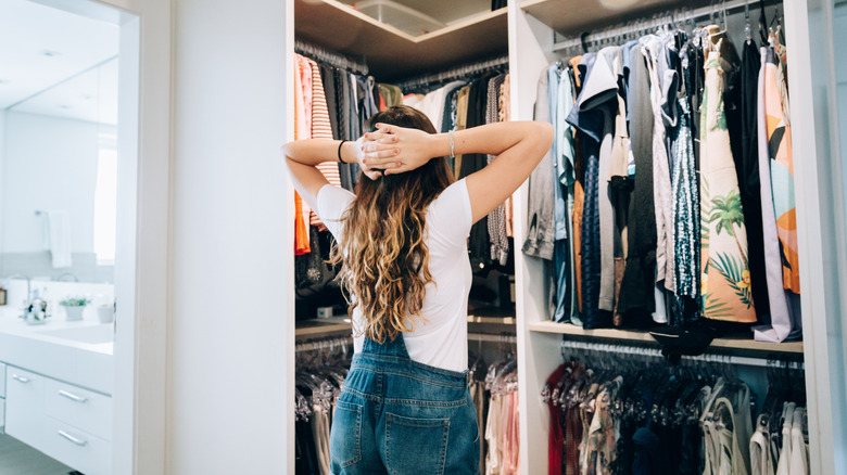 woman looking in closet