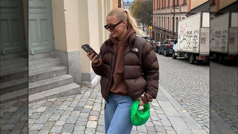 Model wearing brown puffer jacket