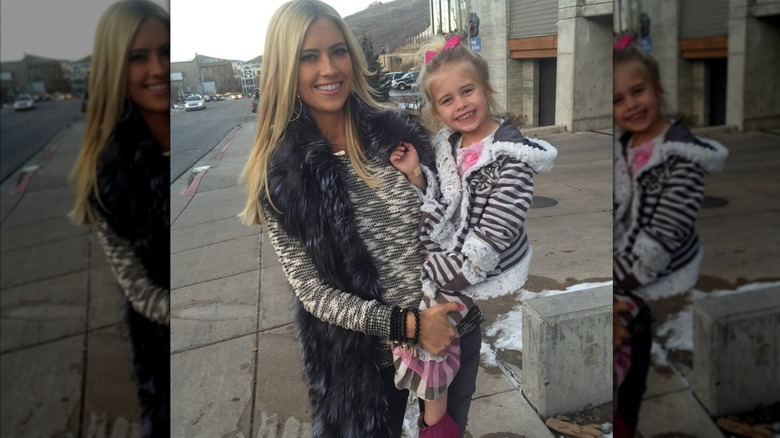 Christina Haack walks the streets of Main St Park City while carrying her daughter