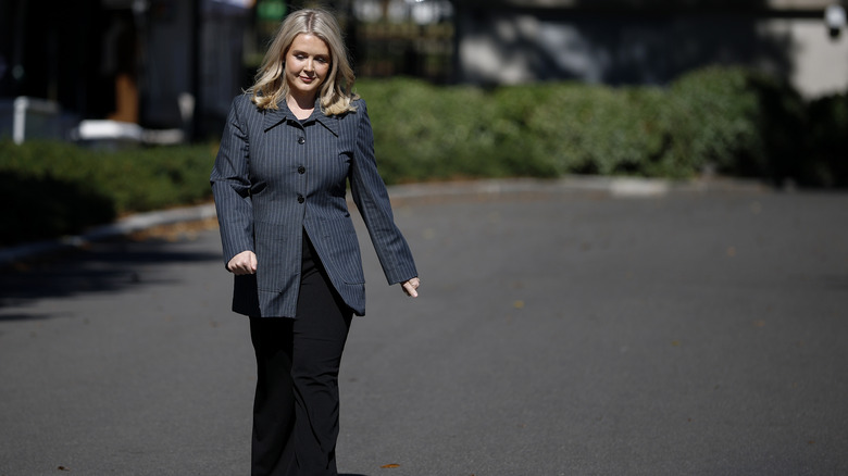 Karoline Leavitt wearing an oversized pinstripe blazer