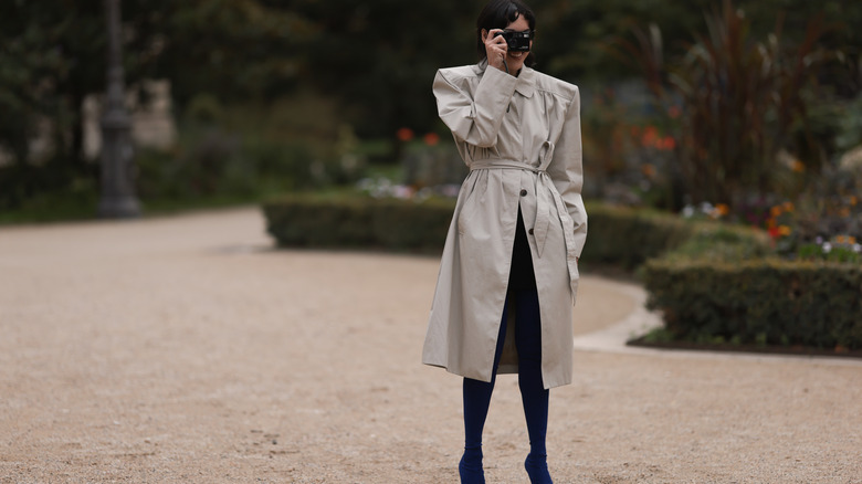 woman wearing long trench coat