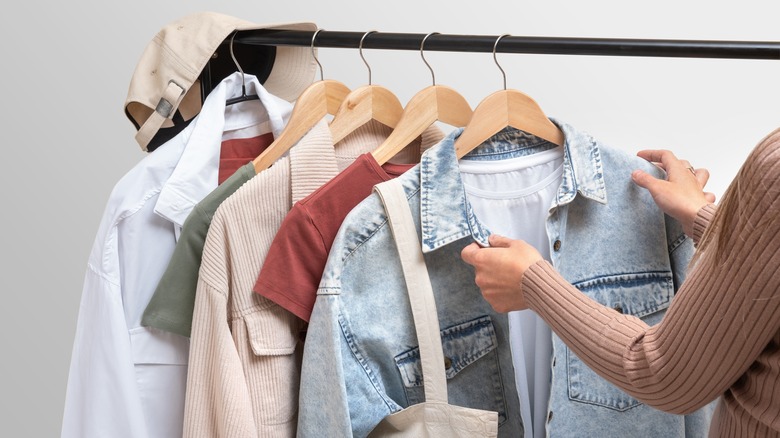 Woman with clothes on hangers