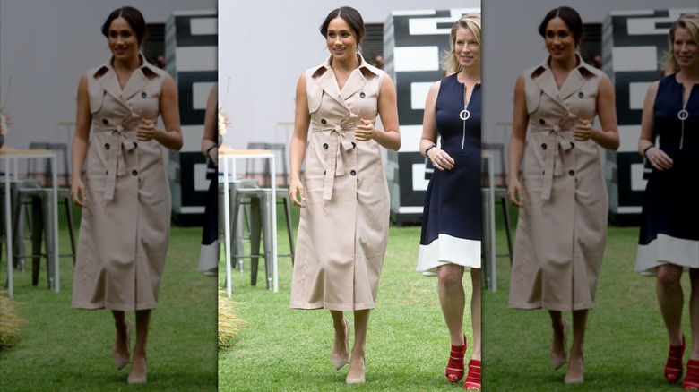 Meghan Markle wears a trench coat dress with short sleeves