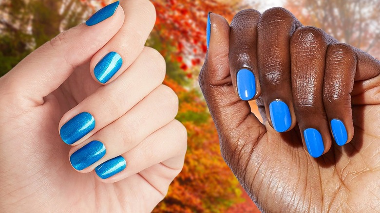 Blue nails on two different hands