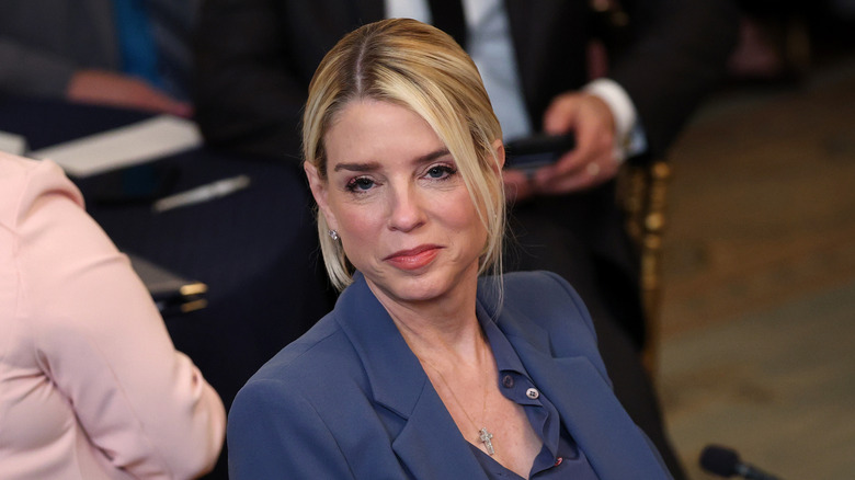 Pam Bondi wearing a navy suit