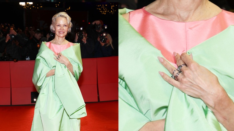 (L) Pamela Anderson wears a green shawl, pink dress, and neutral manicure to the 2026 Berlinale International Film Festival (R) Close up to her nails.