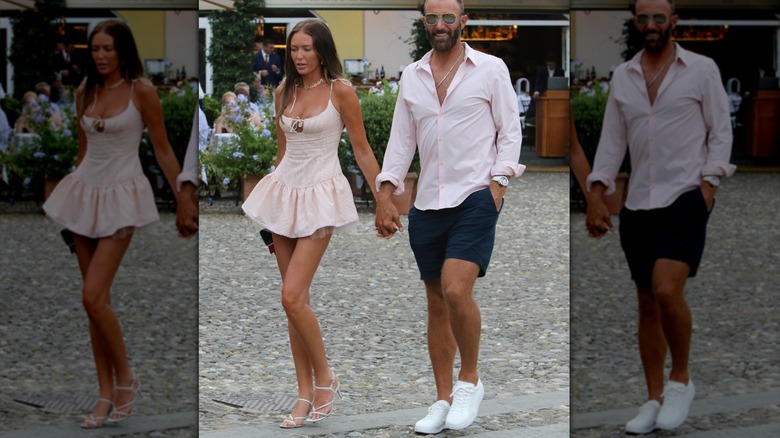 Paulina Gretzky pictured with Dustin Johnson wearing a mini dress and stiletto heels