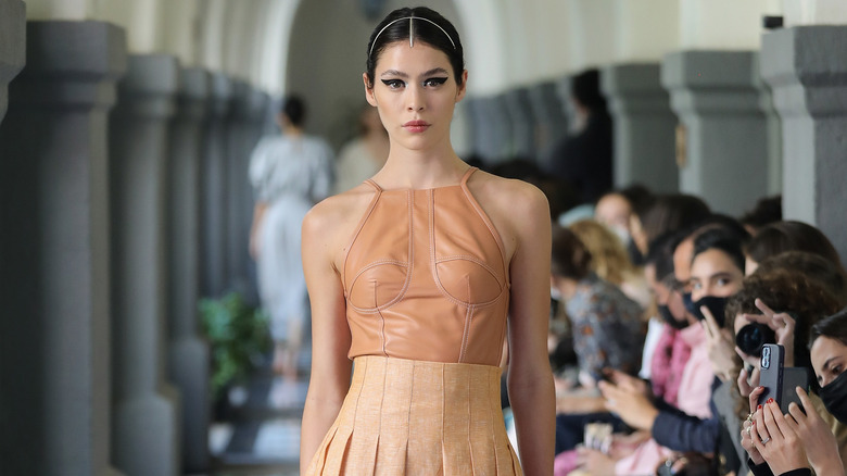 peach halter top and pleated skirt