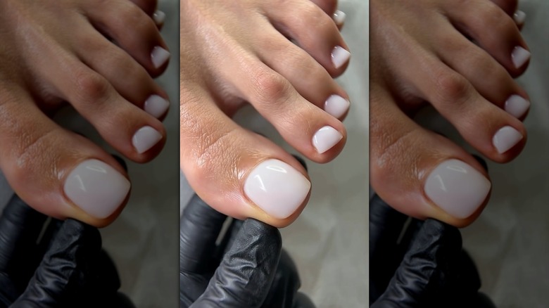 Milky nude toenails during a pedicure
