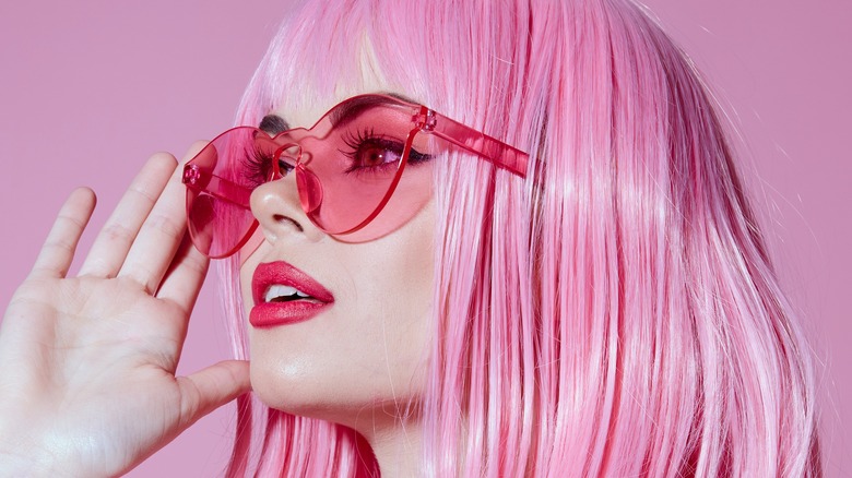 Woman wearing pink glasses