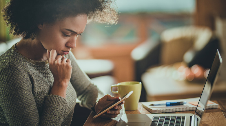 Woman on phone looking concerned