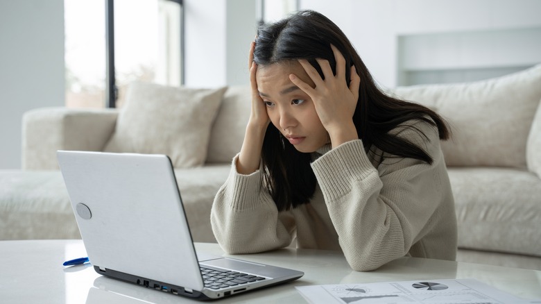 anxious woman on computer