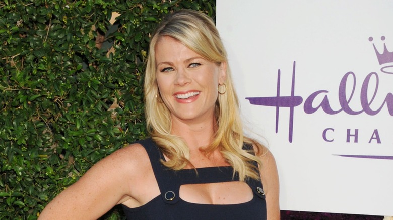 Alison Sweeney wears a sleeveless black dress with her blond hair down at the Summer TCA Tour for the Hallmark Channel in Beverly Hills, California in July of 2015.