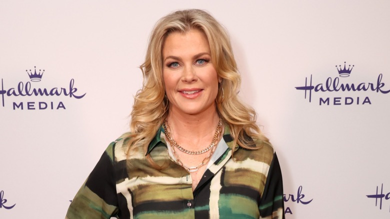Alison Sweeney wears a green and black collared blouse with her blond hair down in waves at the Hallmark Media session of the TCA Winter Press Tour in Pasadena in February 2024.