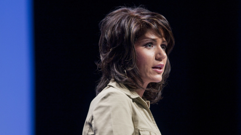Kristi Noem speaks on stage in 2010