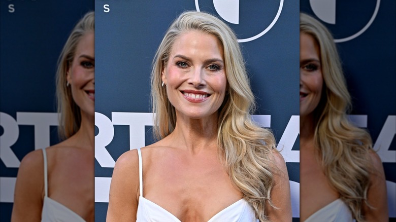 Ali Larter with loose waves and a side part