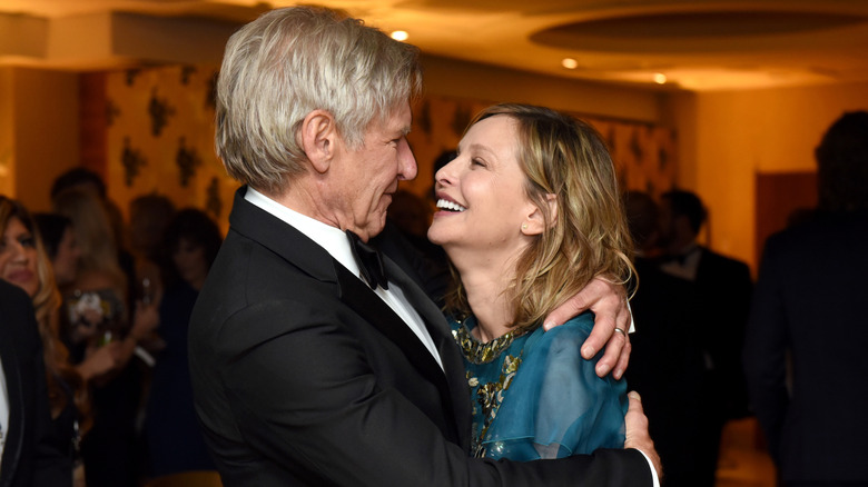 Harrison Ford hugs wife Calista Flockhart at the 2016 HBO Golden Globes after party