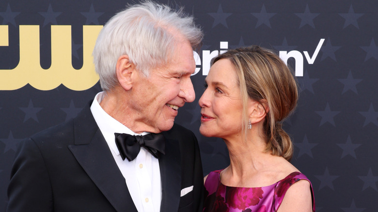 Harrison Ford and Calista Flockhart smiling at each other while attending the 2024 Critic's Choice Awards
