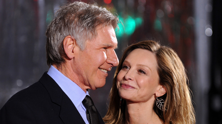 Calista Flockhart and Harrison Ford smile together while attending the "Extraordinary Measures" premiere in 2010