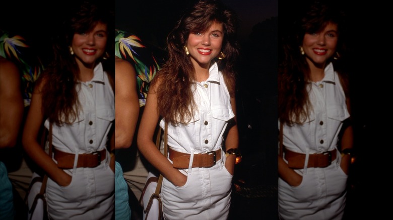 Tiffani Amber Thiessen in a white denim dress in July 1990