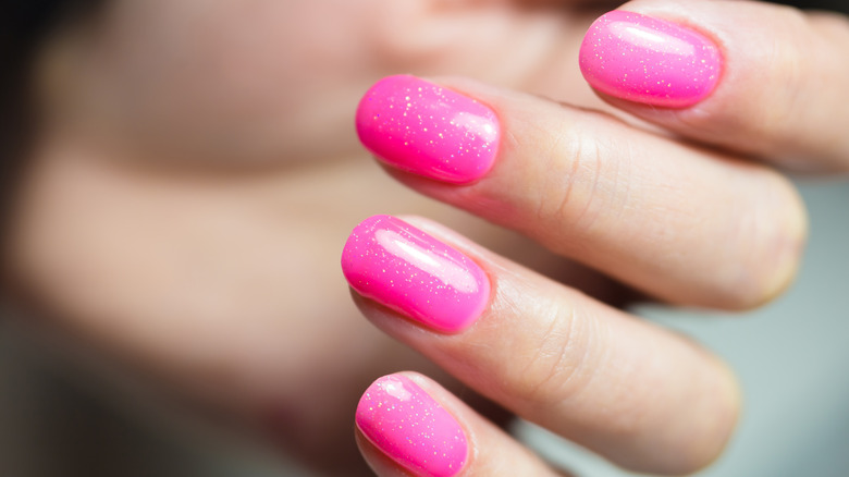 pink glitter nails on fingers