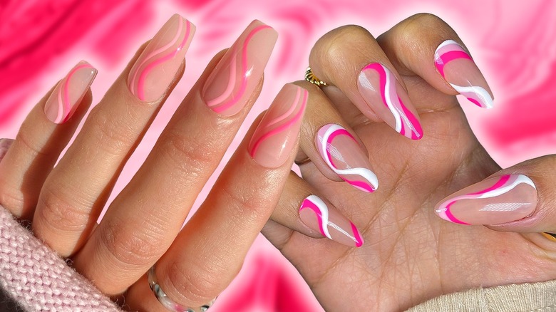 hands with pink swirl nail designs