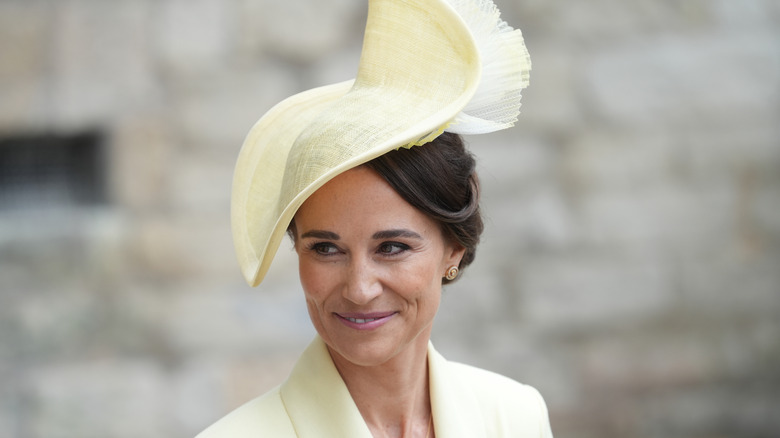 Pippa Middleton wearing a large yellow hat