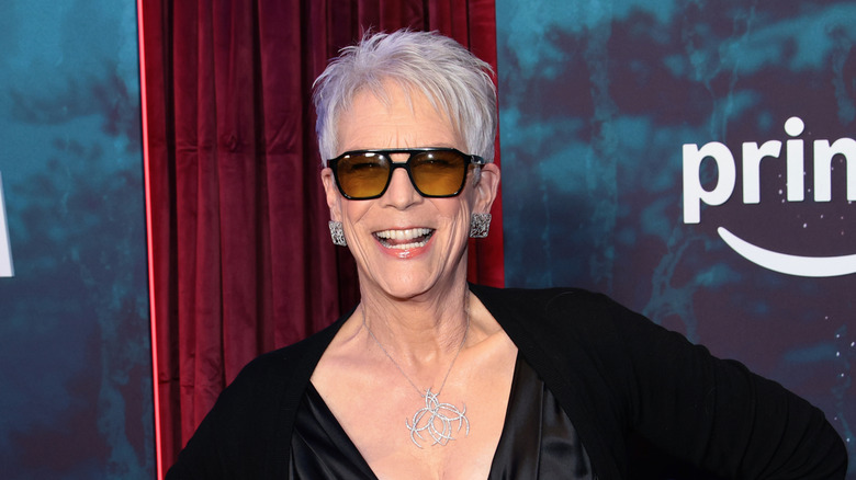 Jamie Lee Curtis smiling in sunglasses